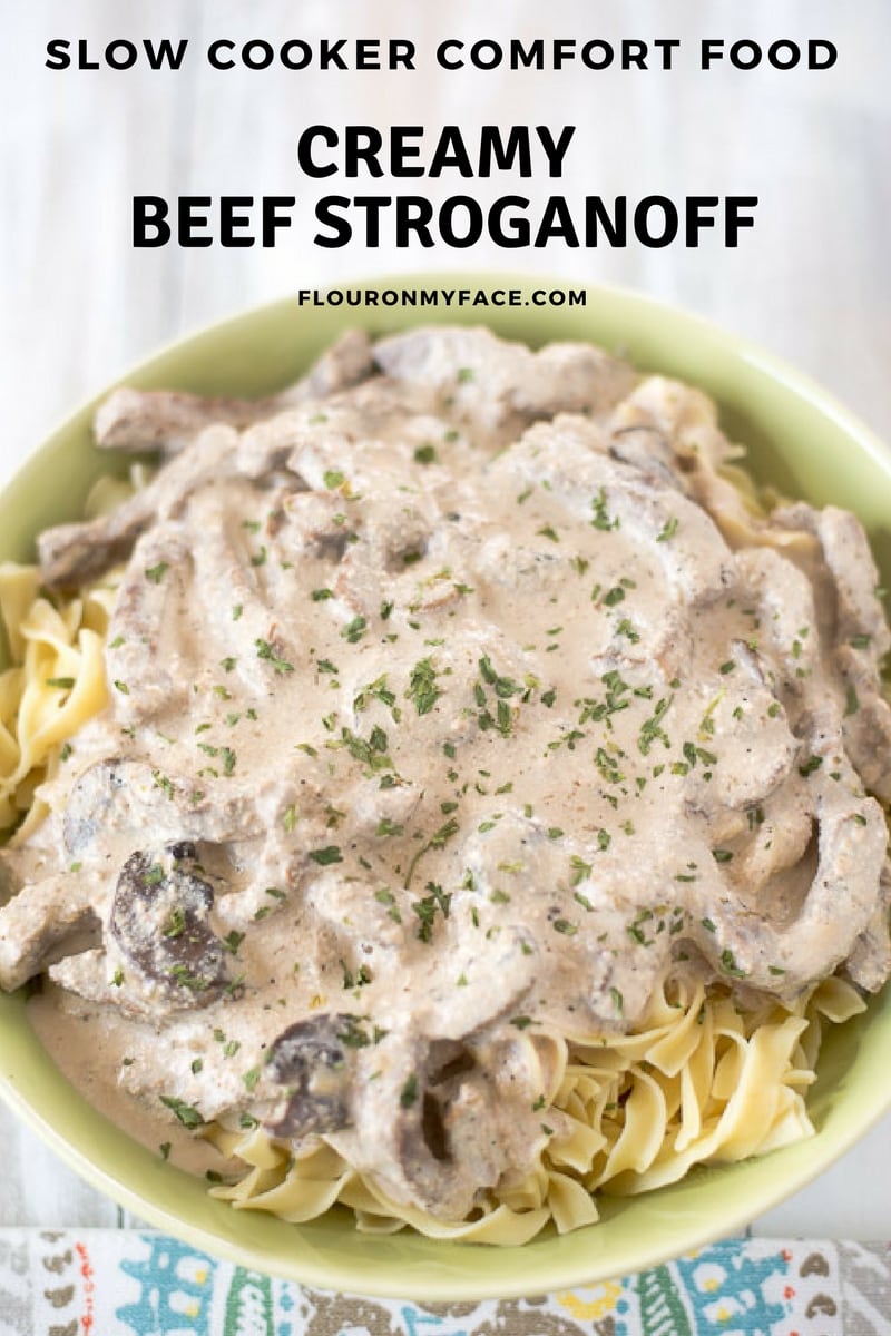 Creamy Crock Pot Beef Stroganoff served over egg noodles