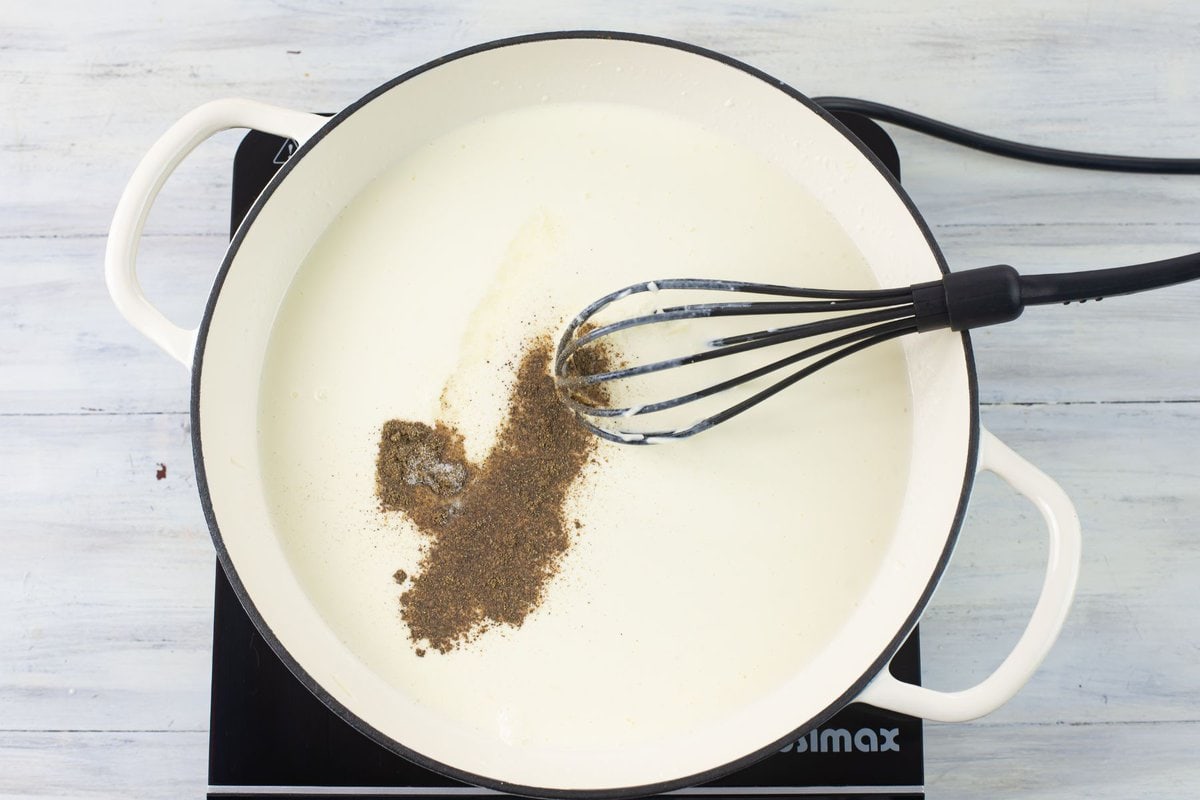 Add salt and pepper to the sauce to season. 