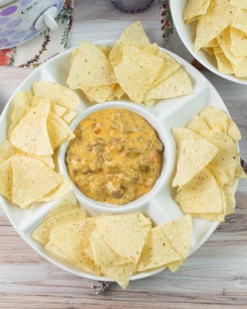 Dip bowl serving crock pot Velveeta Hamburger dip with chips.
